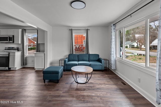 1107 Adams St N, Wilson, NC 27893 - living room featuring healthy amount of natural light and dark wood-style flooring