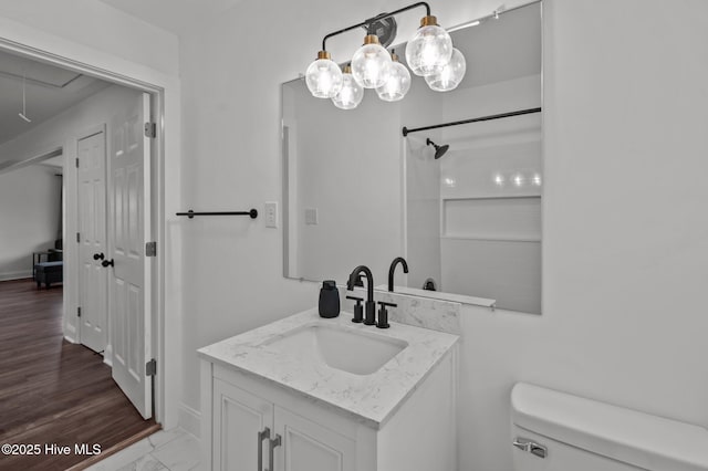 1107 Adams St N, Wilson, NC 27893 - bathroom with toilet, vanity, and marble finish flooring