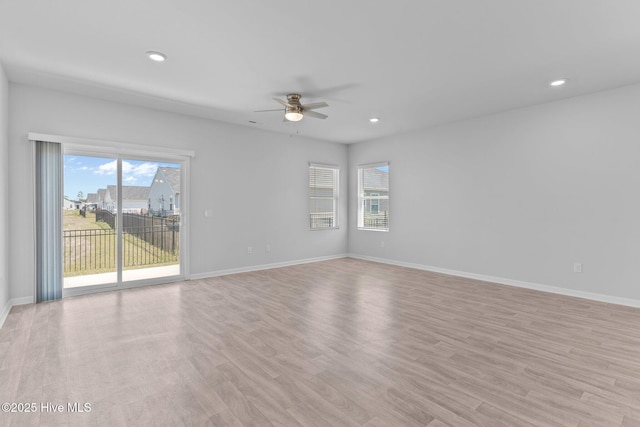 empty room featuring recessed lighting, ceiling fan, and a wealth of natural light
