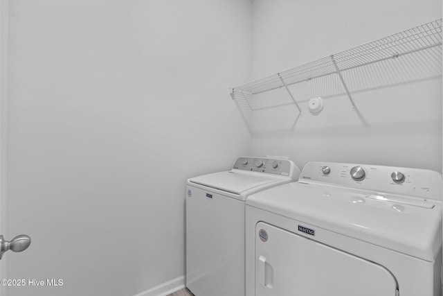 laundry room with laundry area and washer and clothes dryer