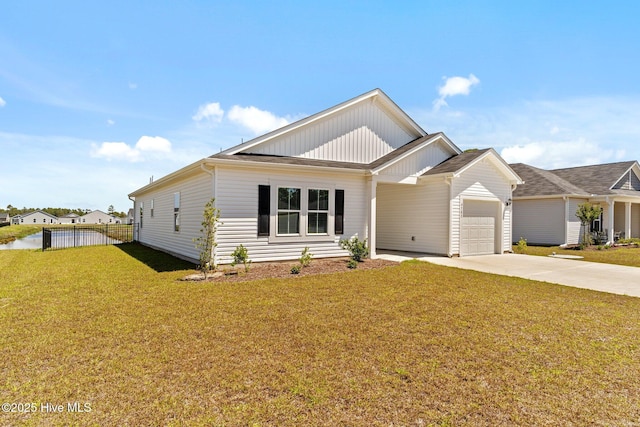 view of front of house with board and batten siding, a front yard, fence, concrete driveway, and an attached garage