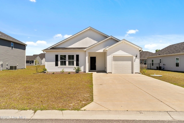 single story home with an attached garage, a front lawn, board and batten siding, and driveway