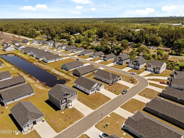 bird's eye view featuring a residential view and a view of trees