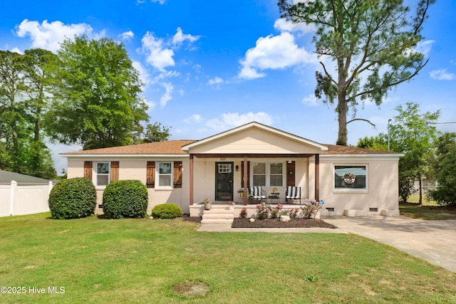 view of front of property featuring a front lawn, crawl space, covered porch, driveway, and fence