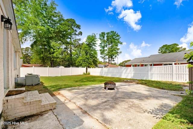view of patio with an outdoor fire pit and a fenced backyard