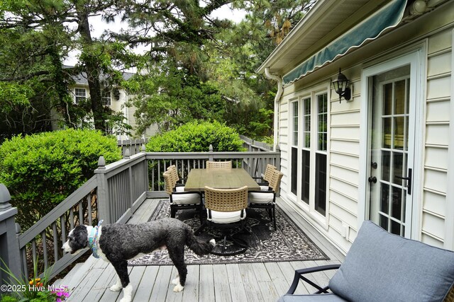 wooden deck with outdoor dining area