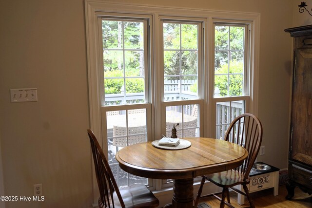 dining area with wood finished floors