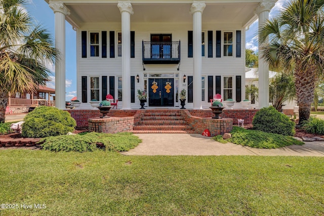753 S Horsepen Dr, Harrells, NC 28444 - exterior space featuring a lawn, french doors, and a balcony