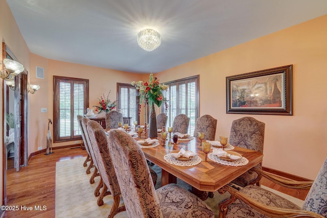 753 S Horsepen Dr, Harrells, NC 28444 - dining area featuring baseboards, a notable chandelier, light wood-style flooring, and visible vents