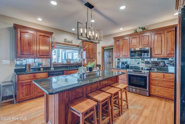 753 S Horsepen Dr, Harrells, NC 28444 - kitchen featuring a kitchen island, recessed lighting, a sink, light wood-style flooring, and appliances with stainless steel finishes