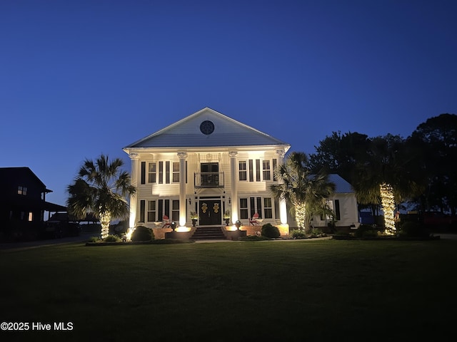 753 S Horsepen Dr, Harrells, NC 28444 - back of house at twilight featuring a balcony