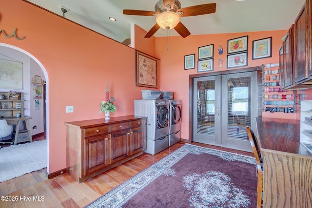 753 S Horsepen Dr, Harrells, NC 28444 - clothes washing area with french doors, a ceiling fan, arched walkways, washing machine and dryer, and light wood-type flooring