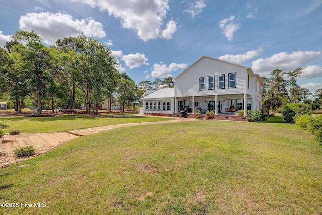 753 S Horsepen Dr, Harrells, NC 28444 - rear view of house with covered porch and a lawn