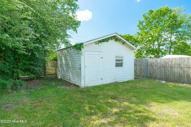 view of shed with a fenced backyard
