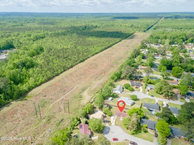 aerial view with a wooded view