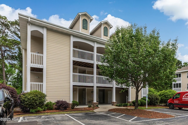 view of property with uncovered parking