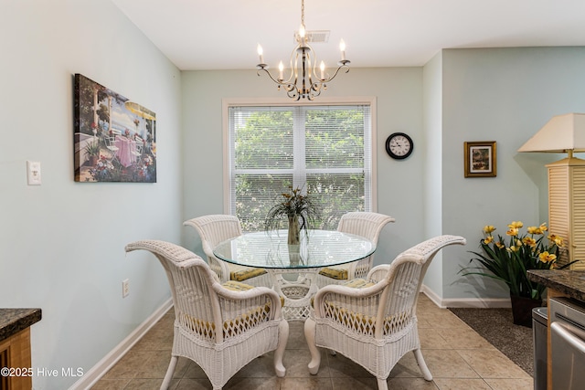 dining space featuring light tile patterned flooring, visible vents, a notable chandelier, and baseboards