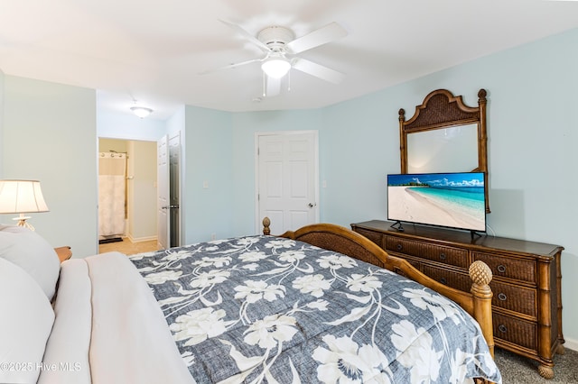bedroom featuring a ceiling fan, baseboards, carpet, and ensuite bathroom