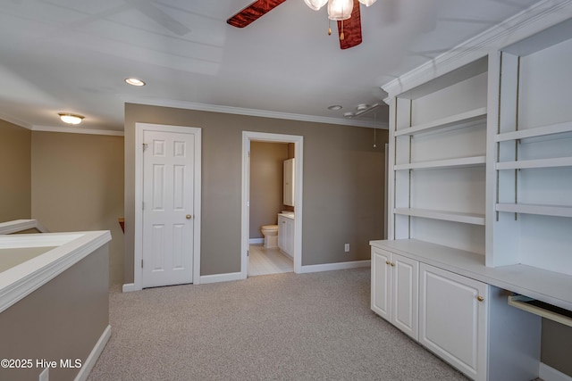 interior space featuring crown molding, light carpet, attic access, recessed lighting, and baseboards