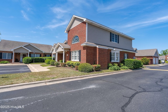 traditional-style house with brick siding