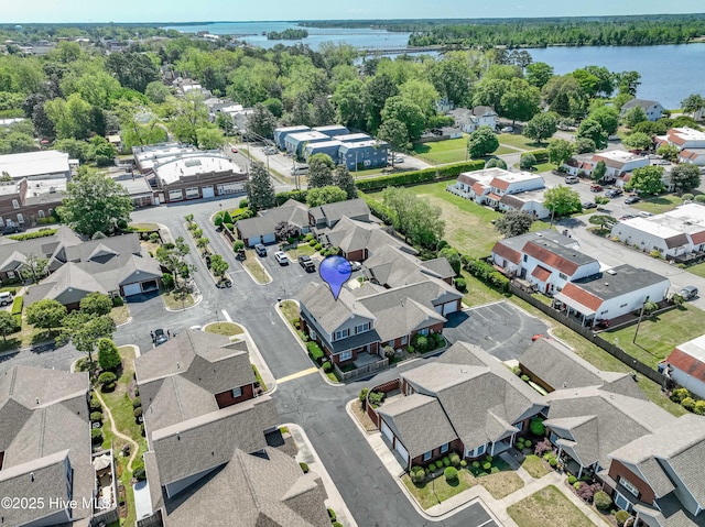 drone / aerial view featuring a residential view and a water view