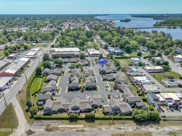 bird's eye view featuring a residential view and a water view
