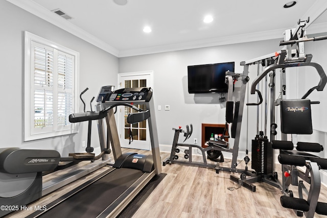 9148 E Lake Rd, Calabash, NC 28467 - workout area with ornamental molding, wood finished floors, recessed lighting, and baseboards