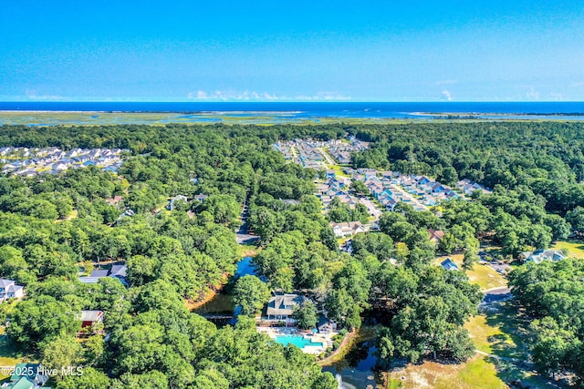 9148 E Lake Rd, Calabash, NC 28467 - aerial view of property and surrounding area with a forest, a nearby body of water, and a pool