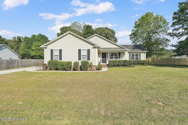 single story home featuring fence, a porch, and a front lawn