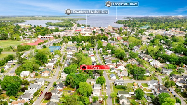 birds eye view of property with a residential view and a water view