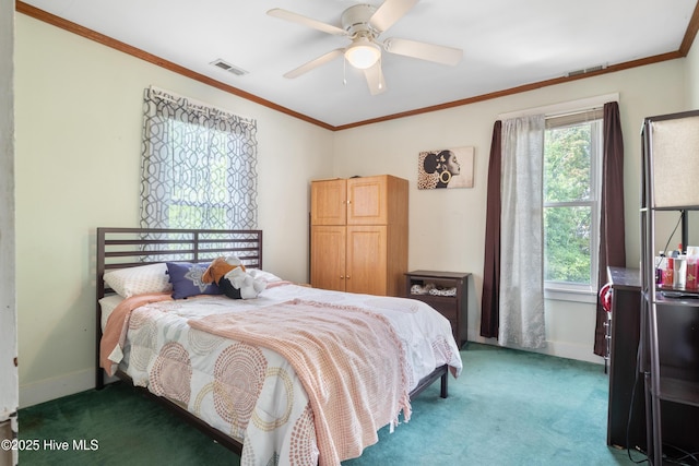 bedroom with crown molding, visible vents, carpet floors, and baseboards