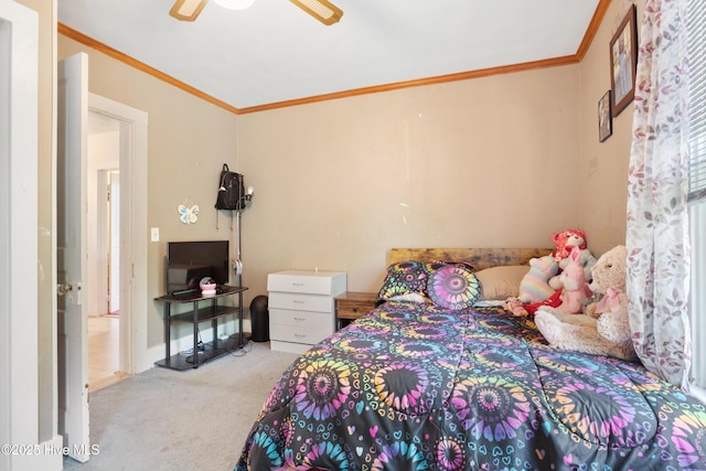 bedroom featuring carpet, ceiling fan, and crown molding
