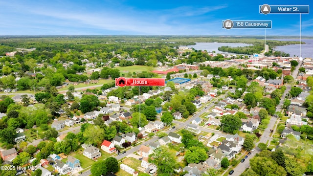 birds eye view of property with a residential view and a water view
