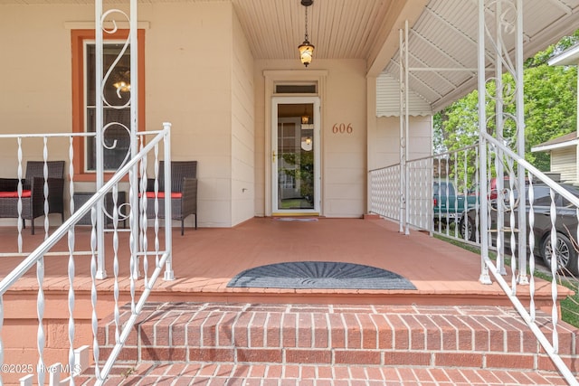 view of exterior entry featuring concrete block siding