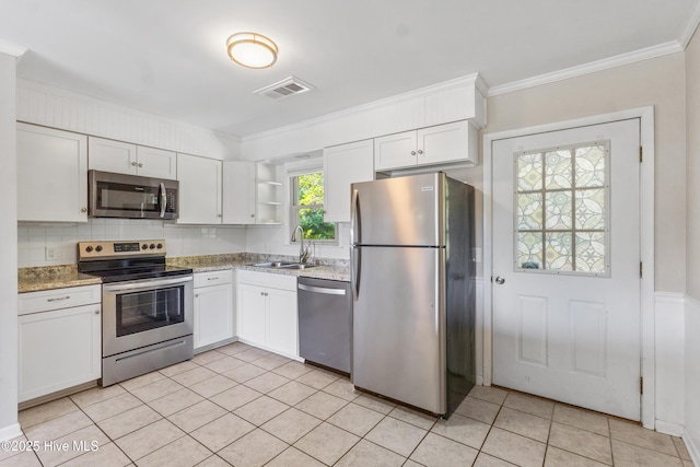 kitchen featuring visible vents, open shelves, a sink, light tile patterned floors, and stainless steel appliances