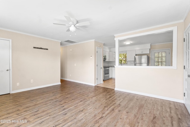 unfurnished living room featuring crown molding and light wood-type flooring