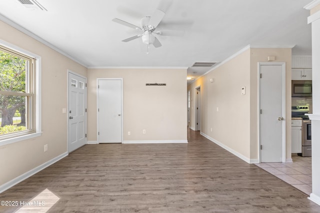 unfurnished living room with ceiling fan, ornamental molding, light wood-style flooring, and visible vents