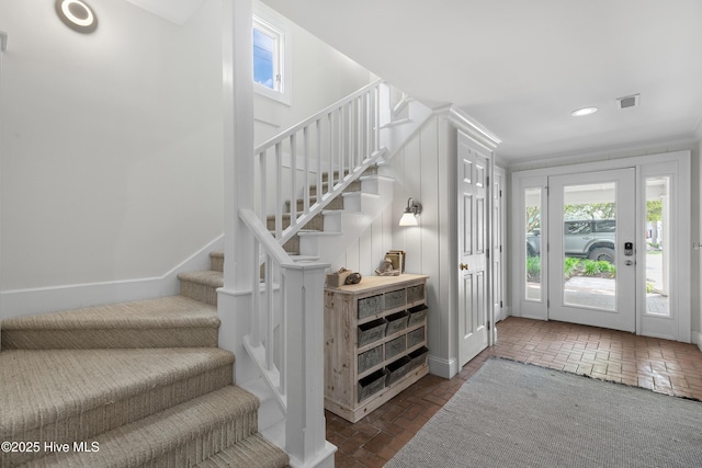 768 S Lumina Ave, Wrightsville Beach, NC 28480 - foyer featuring brick flooring, stairway, recessed lighting, and baseboards