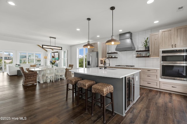 768 S Lumina Ave, Wrightsville Beach, NC 28480 - kitchen featuring appliances with stainless steel finishes, premium range hood, wine cooler, open shelves, and a sink