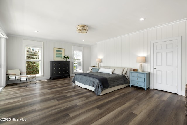 768 S Lumina Ave, Wrightsville Beach, NC 28480 - bedroom with crown molding, dark wood-type flooring, and a decorative wall