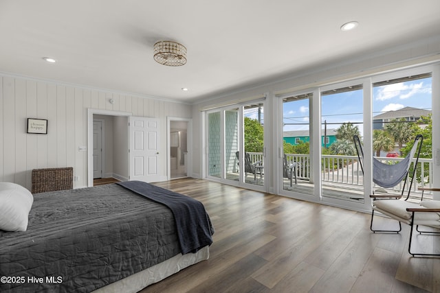 768 S Lumina Ave, Wrightsville Beach, NC 28480 - bedroom with ornamental molding, access to outside, and wood finished floors