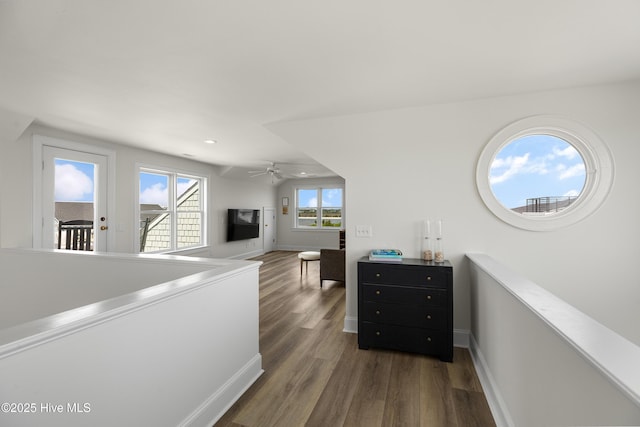 768 S Lumina Ave, Wrightsville Beach, NC 28480 - hall with an upstairs landing, dark wood-style floors, baseboards, and recessed lighting