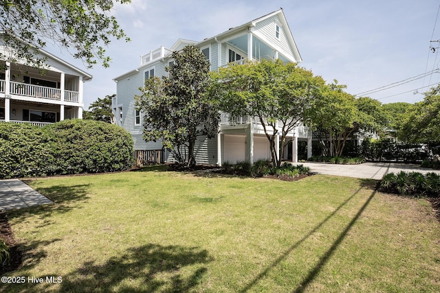 768 S Lumina Ave, Wrightsville Beach, NC 28480 - view of building exterior with an attached garage and driveway