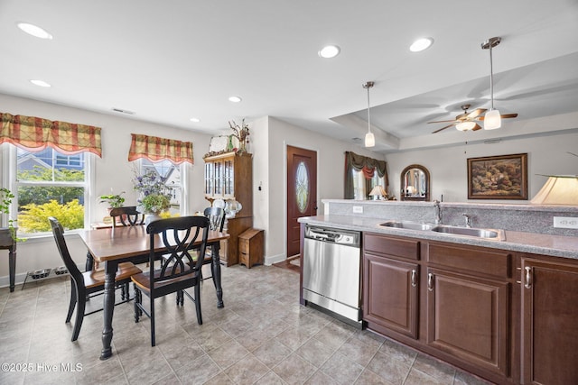 kitchen featuring recessed lighting, dishwasher, baseboards, hanging light fixtures, and a sink