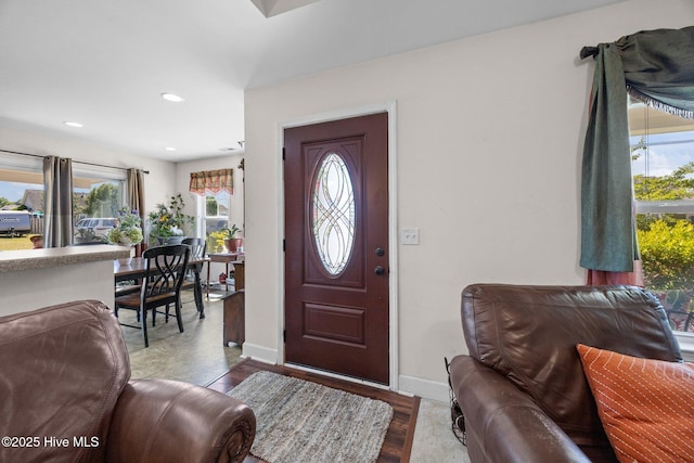 entryway featuring a wealth of natural light, baseboards, and recessed lighting