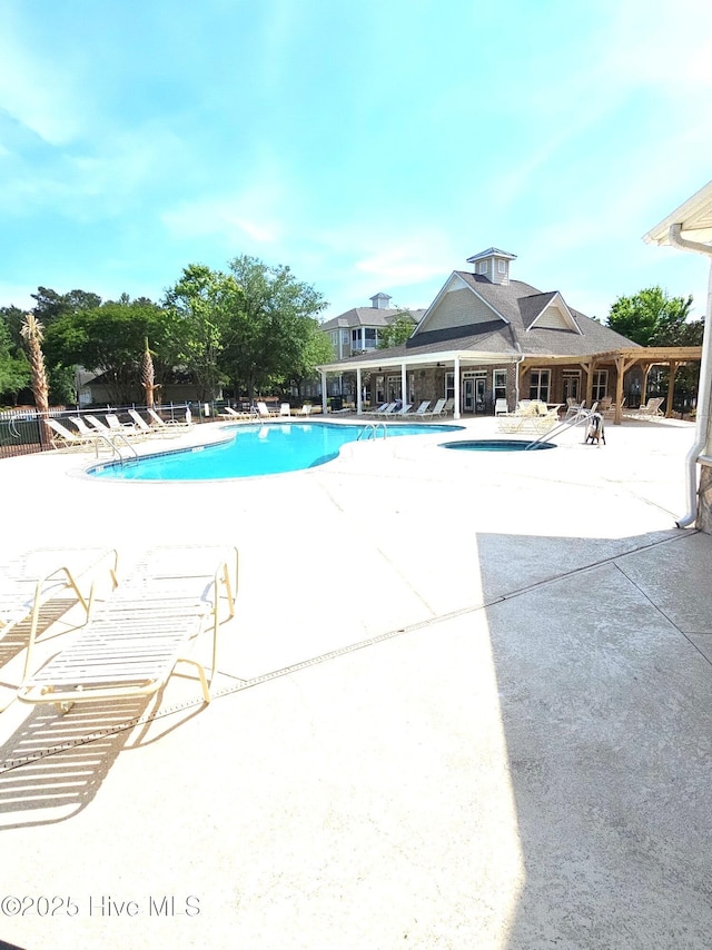community pool with a patio area
