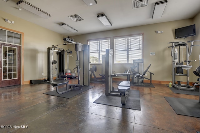 workout area featuring baseboards and visible vents