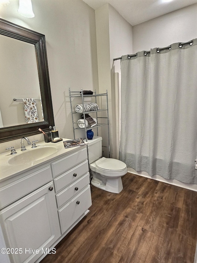 290 Woodlands Way Unit 10, Calabash, NC 28467 - full bath with vanity, wood finished floors, and shower / bath combo with shower curtain