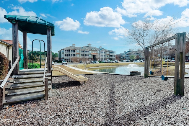 community playground with a water view and a residential view