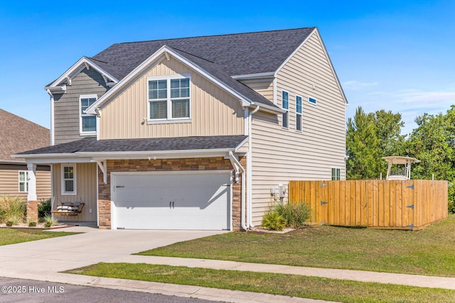 view of front of home with a garage, a front lawn, fence, board and batten siding, and driveway